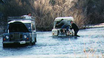 Vance Chin and Ben Smith trying to not get their feet wet.