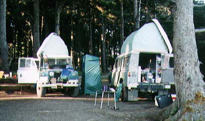 Land Rovers in camp.